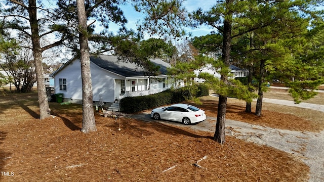 view of side of home with a porch