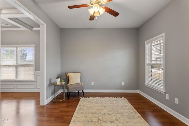 living area with ceiling fan and dark wood-type flooring