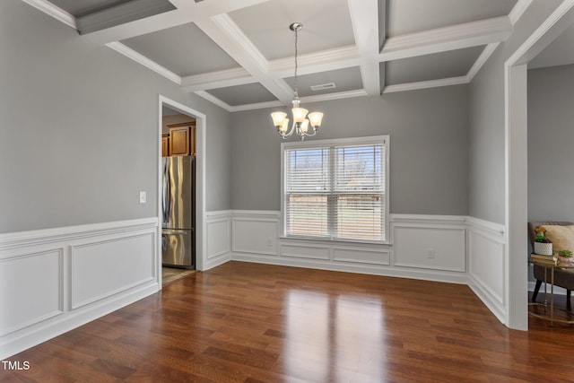 unfurnished dining area with beam ceiling, crown molding, coffered ceiling, dark hardwood / wood-style flooring, and a chandelier