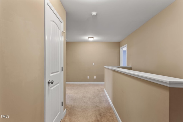 hallway with light colored carpet