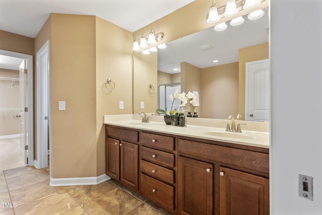 bathroom featuring an enclosed shower and vanity