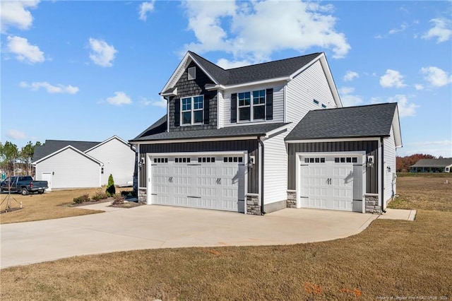 view of front of house with a front lawn and a garage