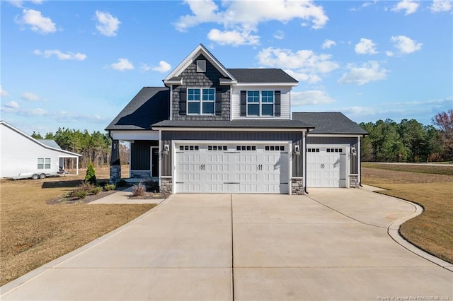 craftsman-style home with a garage and a front lawn