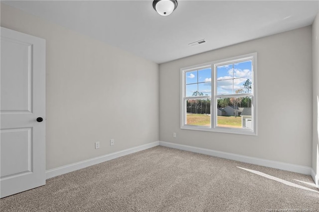 empty room featuring light colored carpet