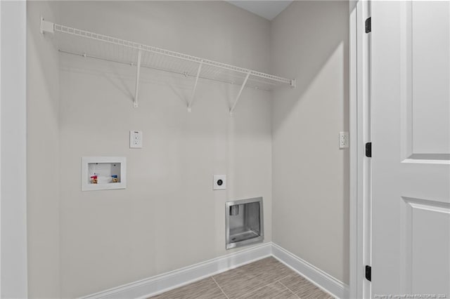 washroom with hookup for a washing machine and electric dryer hookup