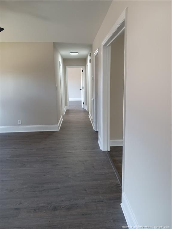 hall featuring dark wood-type flooring