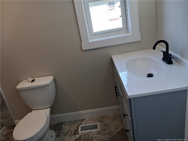 bathroom with vanity and toilet