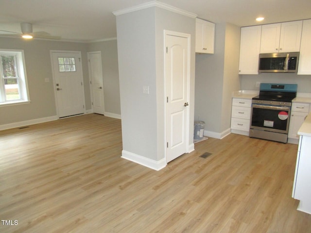 2253 NC Highway 96 S, Franklinton, NC 27525 - kitchen featuring stainless steel appliances, crown molding, light countertops, white cabinets, and recessed lighting