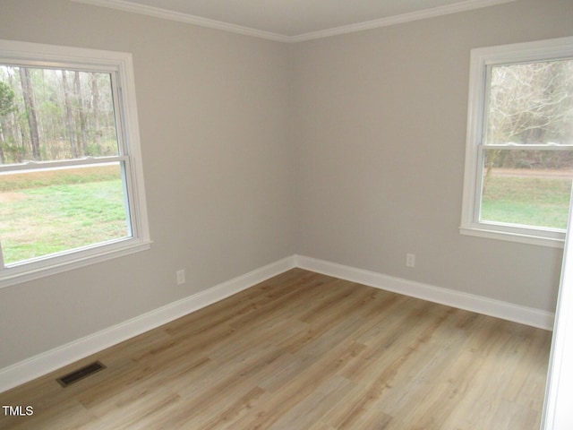 2253 NC Highway 96 S, Franklinton, NC 27525 - unfurnished room with ornamental molding, plenty of natural light, and light wood finished floors