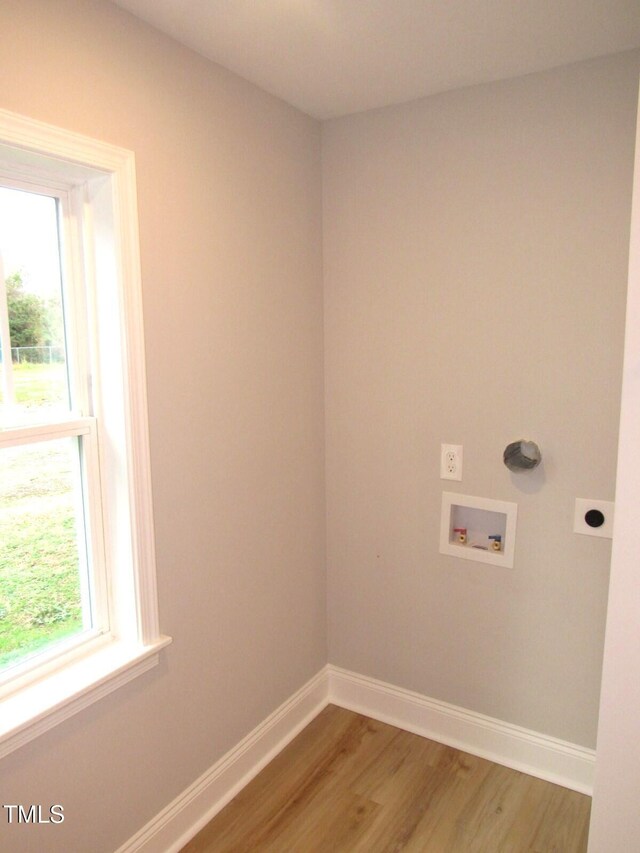 2253 NC Highway 96 S, Franklinton, NC 27525 - washroom with hookup for an electric dryer, light wood-type flooring, healthy amount of natural light, and hookup for a washing machine