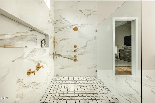 bathroom featuring a tile shower