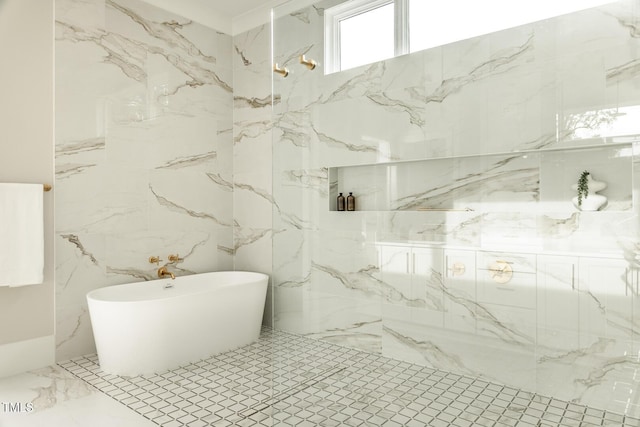 bathroom with a tub and tile walls