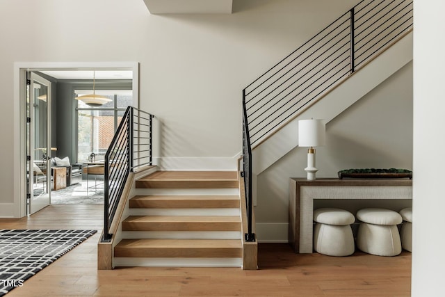 staircase featuring hardwood / wood-style floors