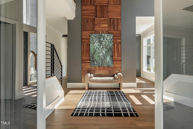 interior space with crown molding and light hardwood / wood-style flooring