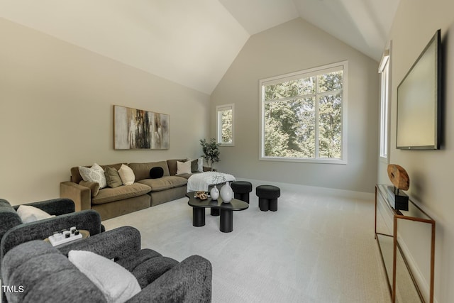 carpeted living room with lofted ceiling