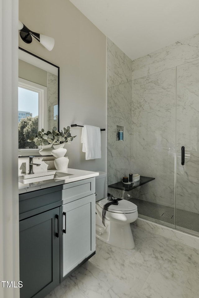 bathroom featuring walk in shower, vanity, and toilet