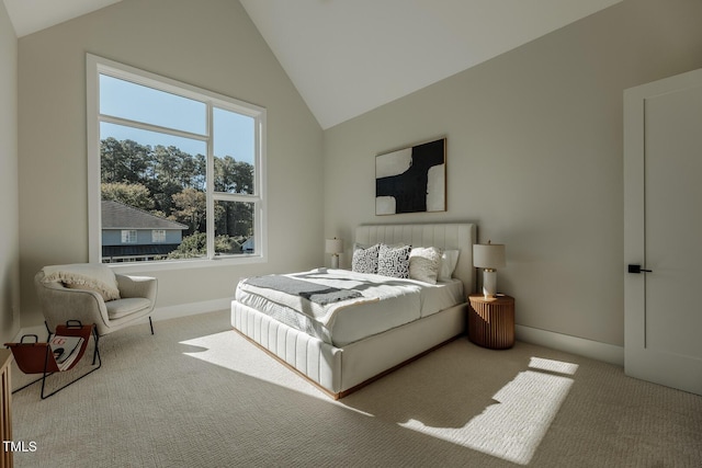 bedroom featuring light carpet and vaulted ceiling