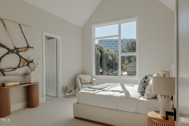 bedroom featuring carpet and lofted ceiling