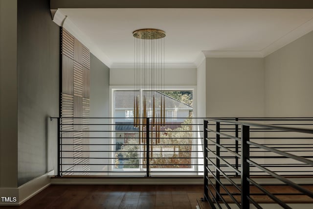 corridor with dark hardwood / wood-style flooring and ornamental molding