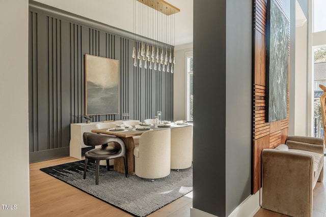 dining space with light hardwood / wood-style flooring