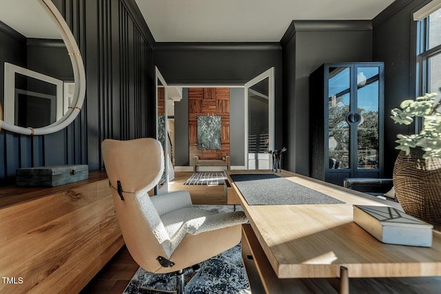 sitting room with hardwood / wood-style floors and ornamental molding