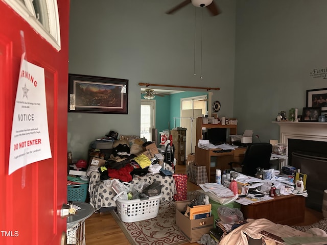 miscellaneous room with ceiling fan and hardwood / wood-style flooring