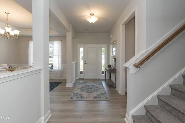 entrance foyer featuring a notable chandelier and light wood-type flooring