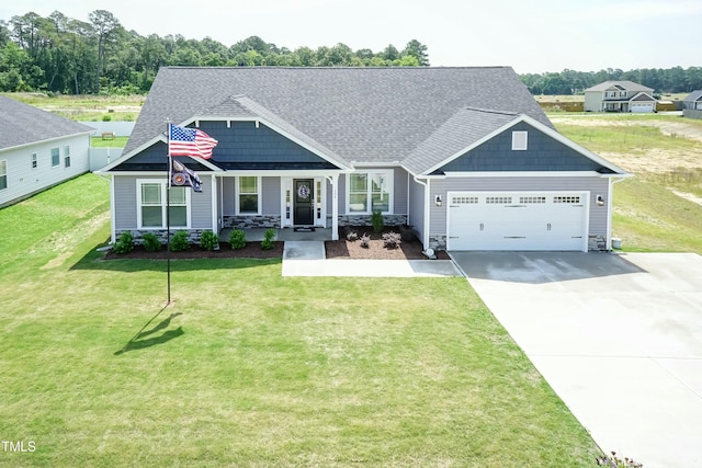 craftsman house with driveway, stone siding, and a garage