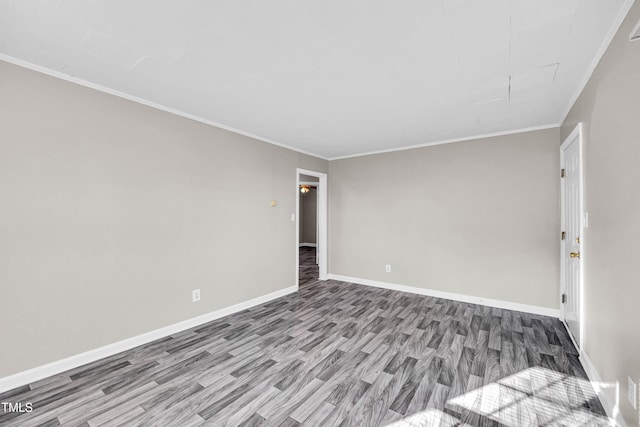 unfurnished room with wood-type flooring and ornamental molding