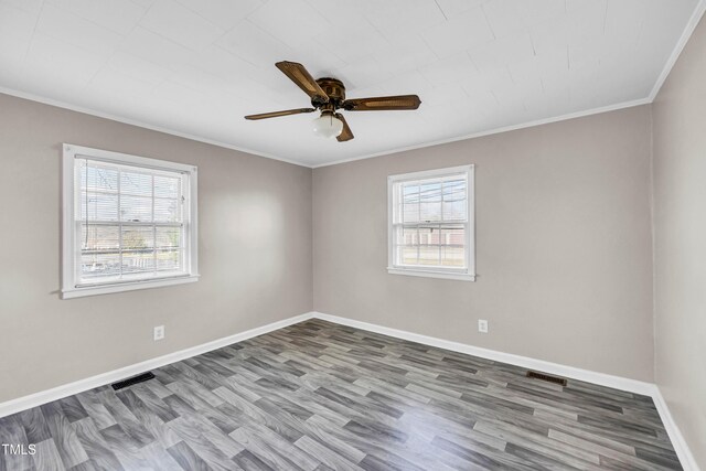 empty room with wood-type flooring, ceiling fan, and crown molding