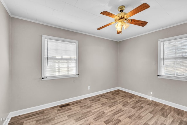 spare room with ceiling fan, light wood-type flooring, and ornamental molding