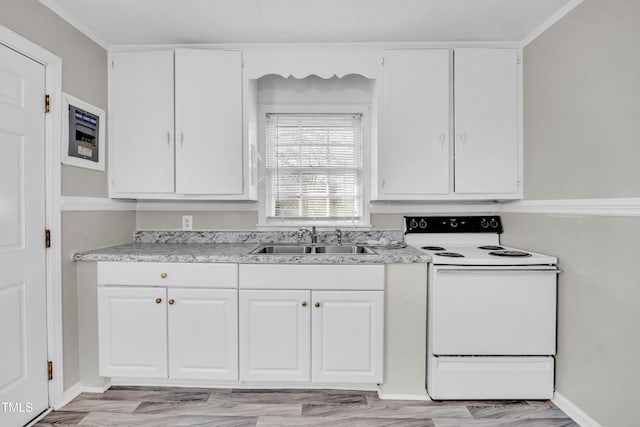 kitchen featuring white cabinets, sink, and electric stove