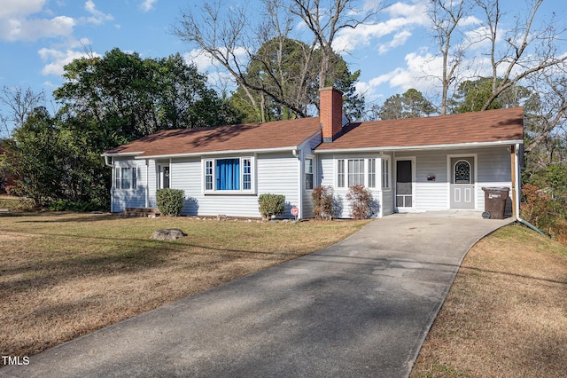 ranch-style house with a front lawn