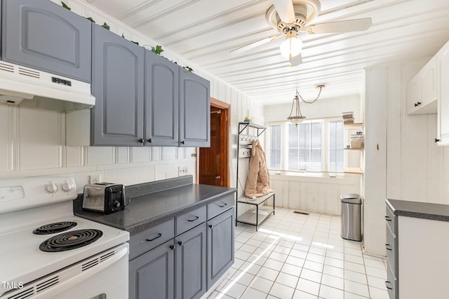 kitchen featuring light tile patterned flooring, ceiling fan, gray cabinetry, and electric stove