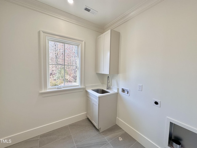 laundry room with light tile patterned floors, electric dryer hookup, washer hookup, ornamental molding, and sink