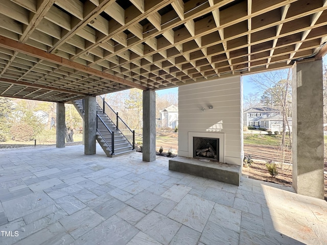 view of patio / terrace with a large fireplace