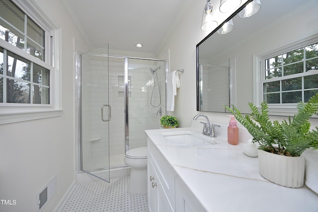 bathroom with crown molding, a shower with door, vanity, and toilet