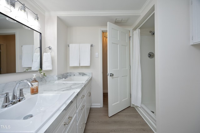 bathroom with hardwood / wood-style floors, vanity, ornamental molding, and a shower with shower curtain