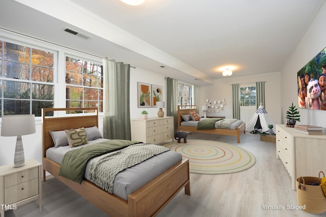 bedroom with light wood-type flooring