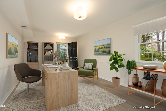 home office with wood-type flooring