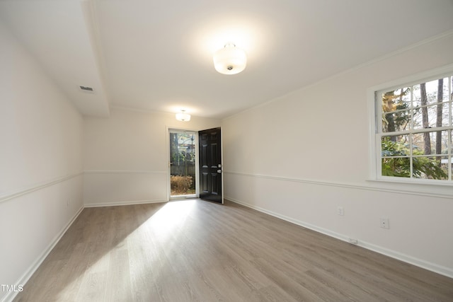 unfurnished room with hardwood / wood-style floors