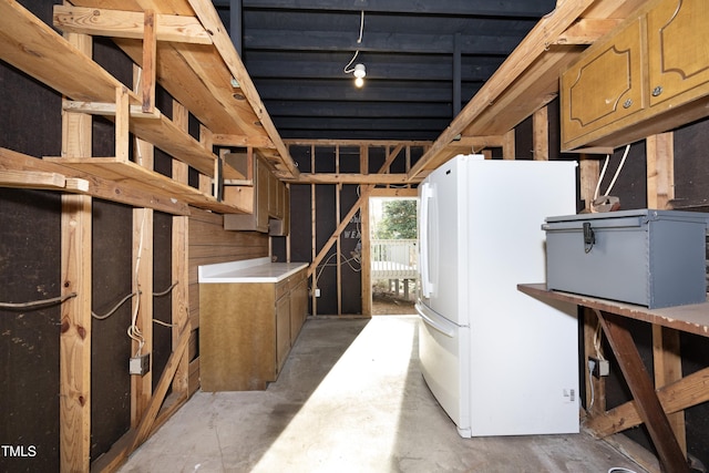 basement with white fridge