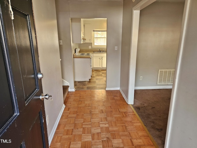 hall with light parquet flooring