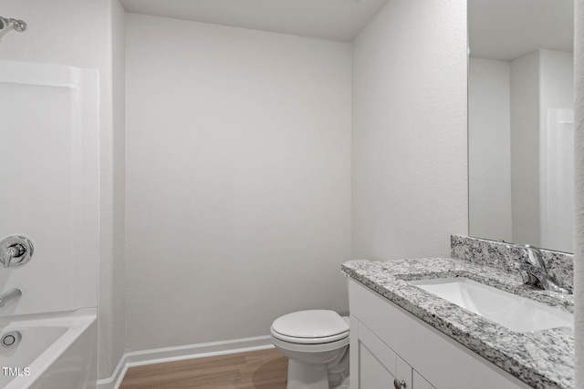 full bathroom with toilet, vanity, shower / bath combination, and hardwood / wood-style flooring