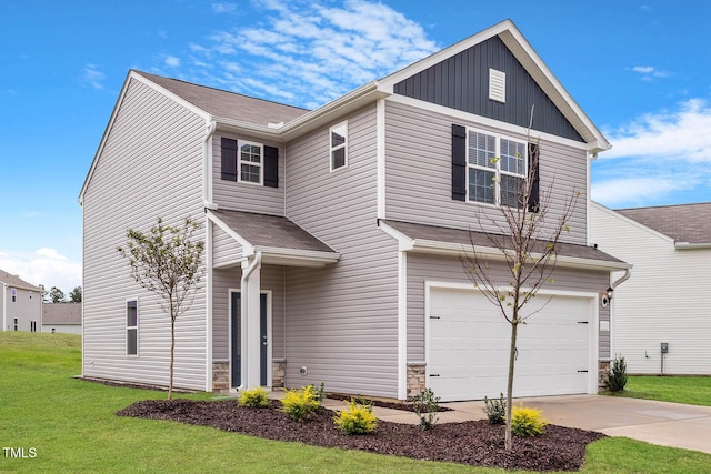 view of front facade featuring a garage and a front yard