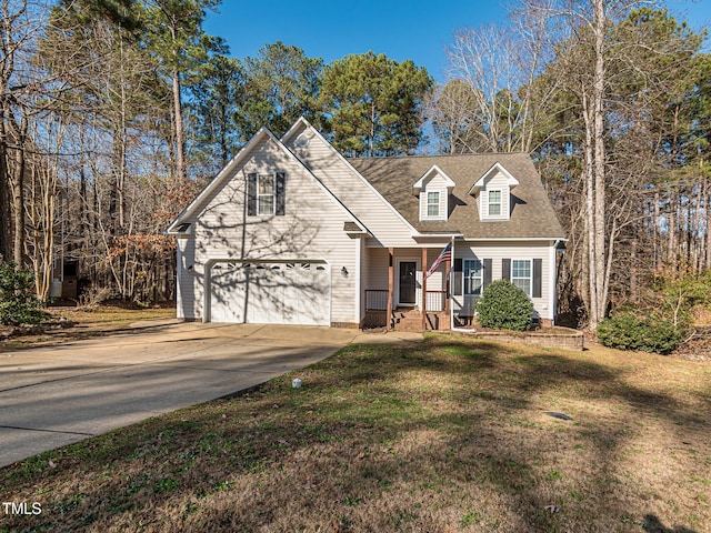 view of front of home with a front lawn and a garage