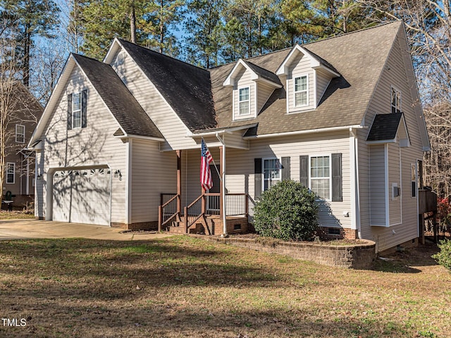 new england style home with driveway, a front lawn, crawl space, and a shingled roof