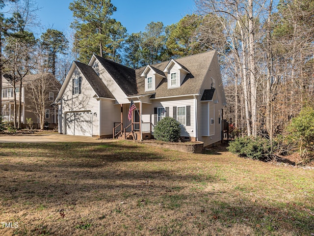 cape cod house featuring an attached garage, concrete driveway, crawl space, and a front yard