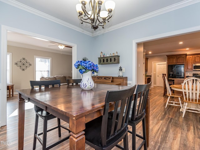 dining room with dark wood-style floors, recessed lighting, crown molding, and ceiling fan with notable chandelier