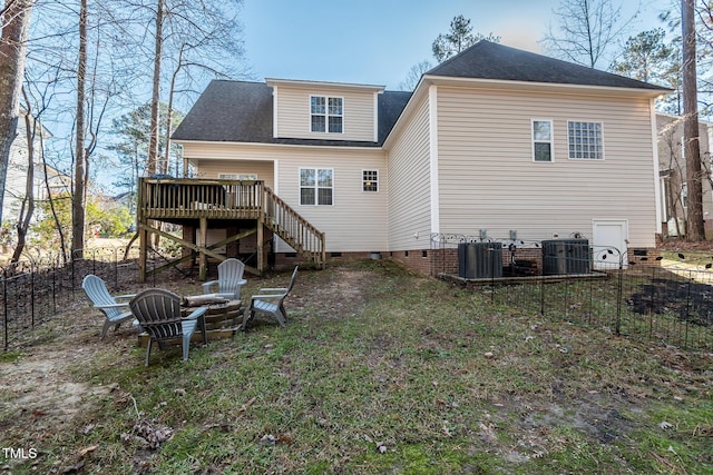 rear view of house with a fire pit, fence, stairs, crawl space, and a wooden deck